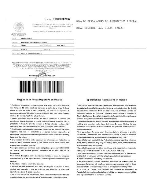 Smiling angler holding a fish and a Mexican fishing license on a boat in Cabo San Lucas