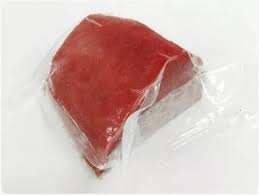Frozen fish fillets packed in a cooler, ready for flight from Cabo