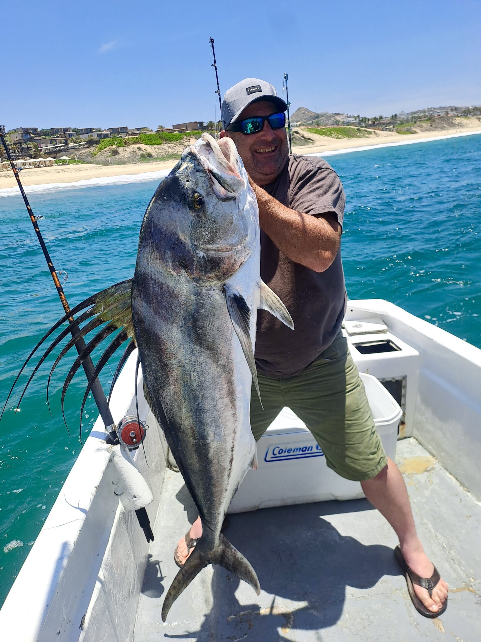 Client smiling with roosterfish catch on Daliken Sportfishing panga