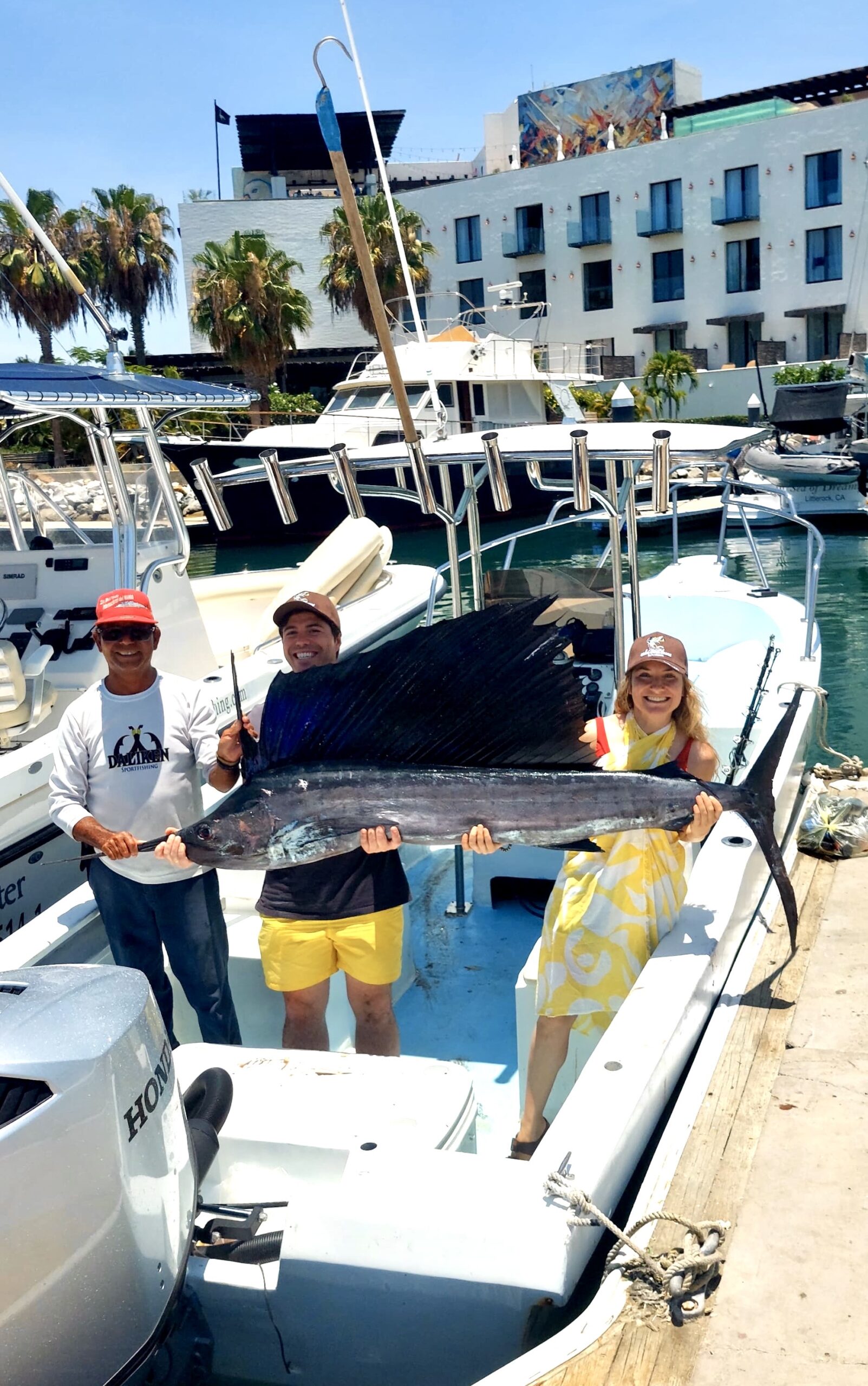Angler holding a released sailfish offshore San José del Cabo