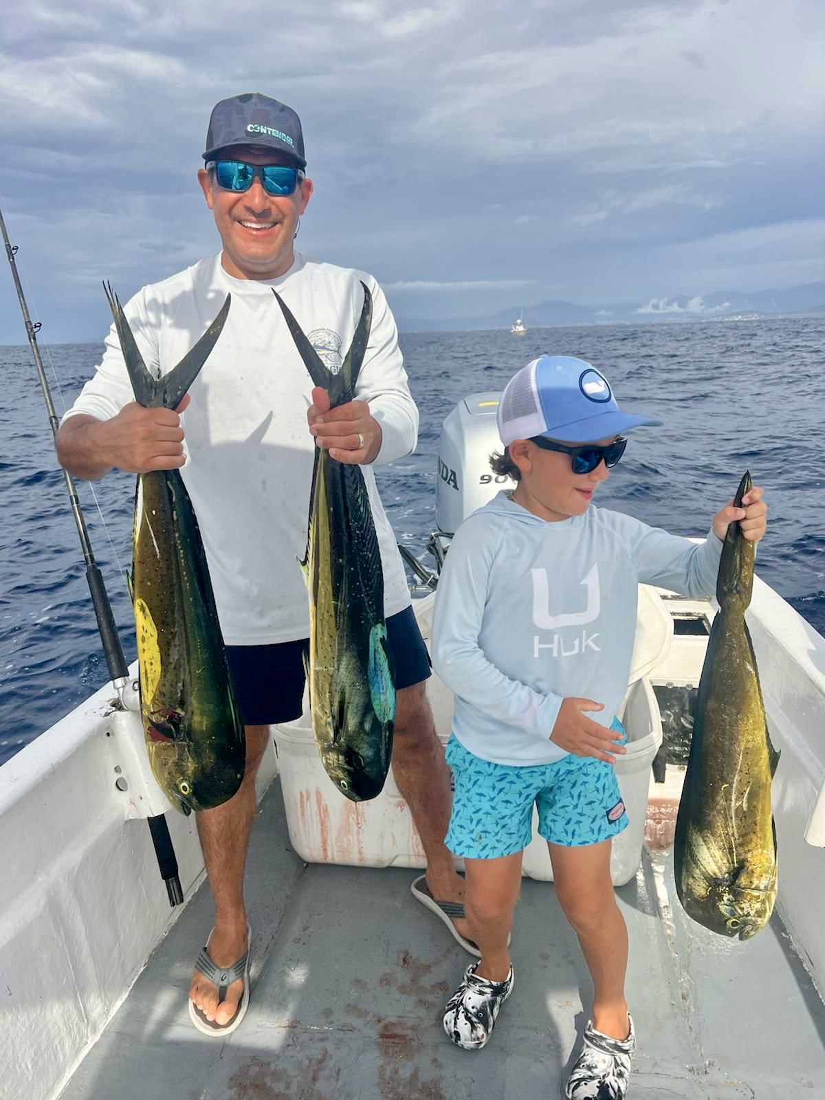 Father and son with dorado in Cabo