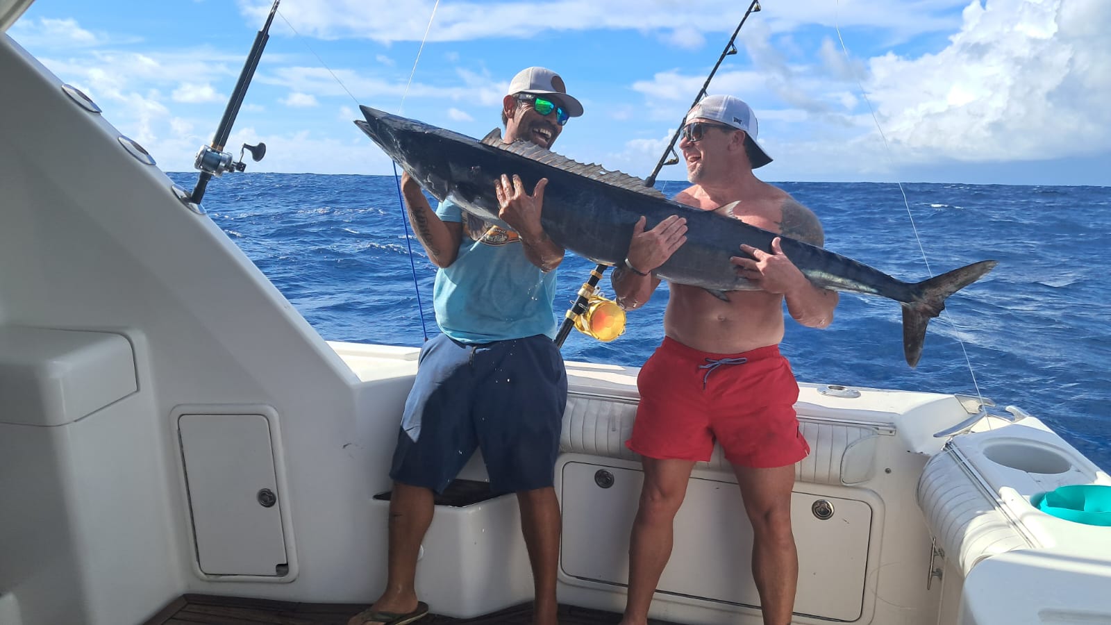 Angler and crew holding a fresh Wahoo
