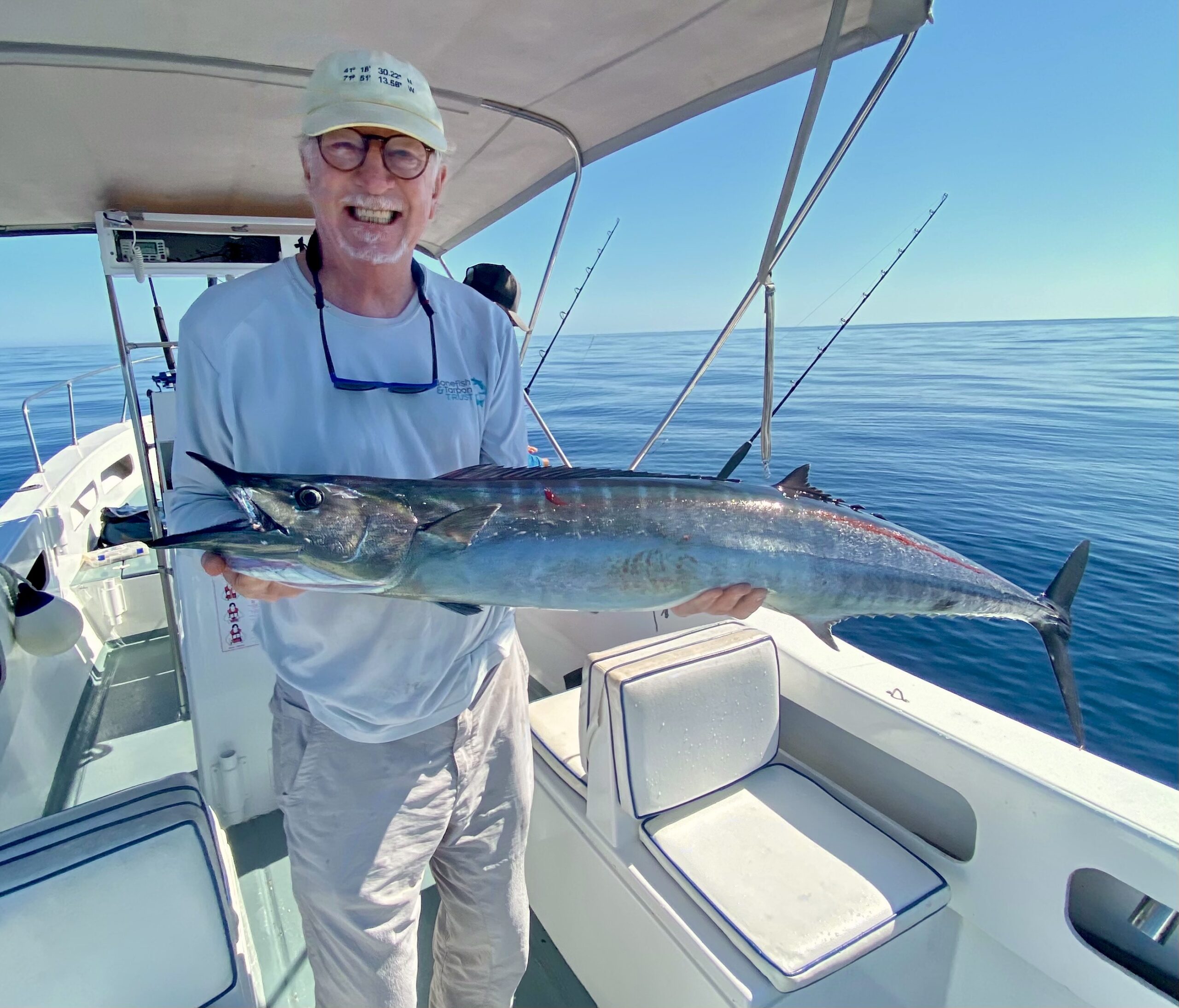 Angler holding a 20–30 lb wahoo from Gordo Bank near San José del Cabo