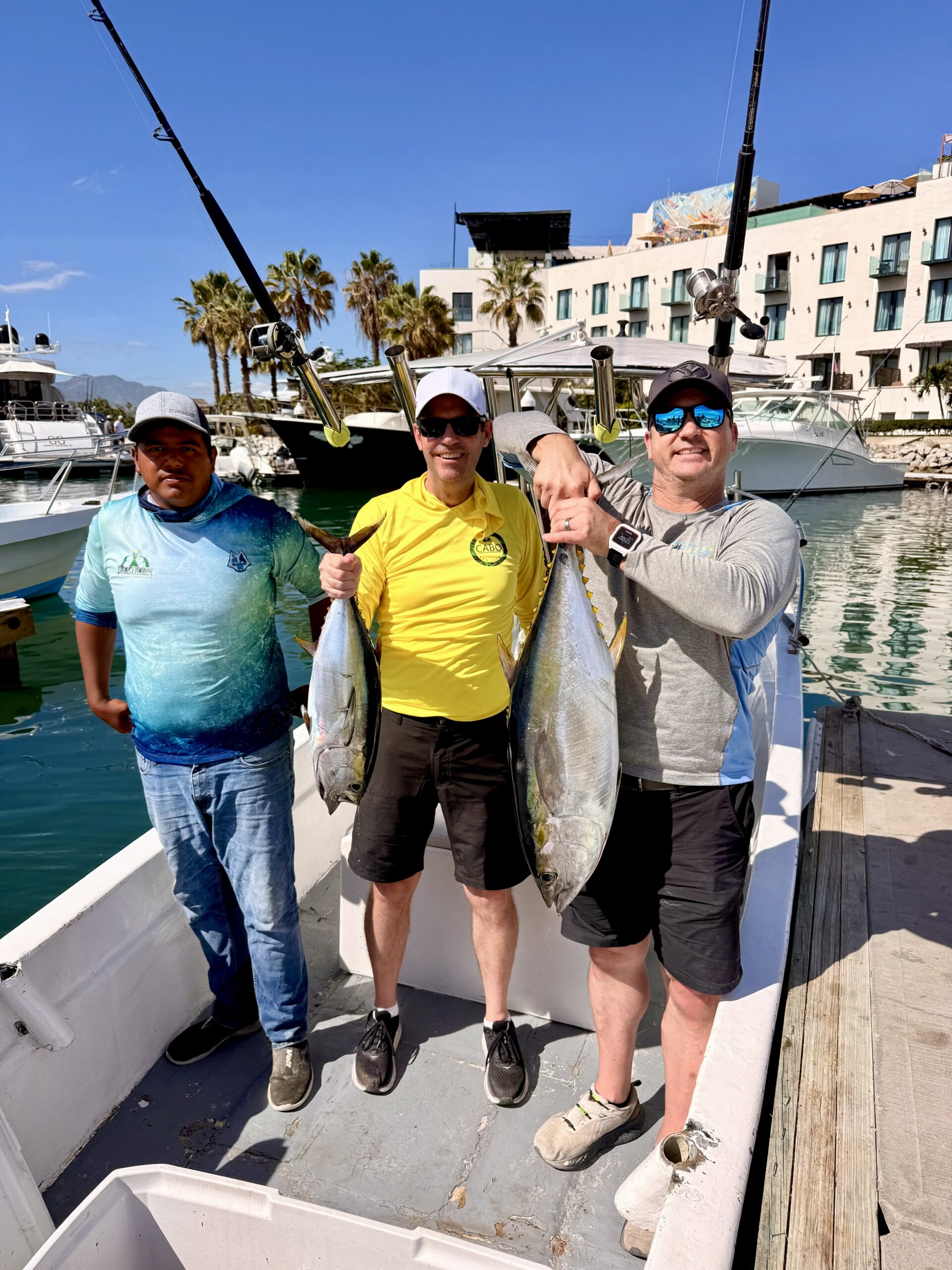 Family with a nice tuna on the dock after fishing with Daliken Sportfishing