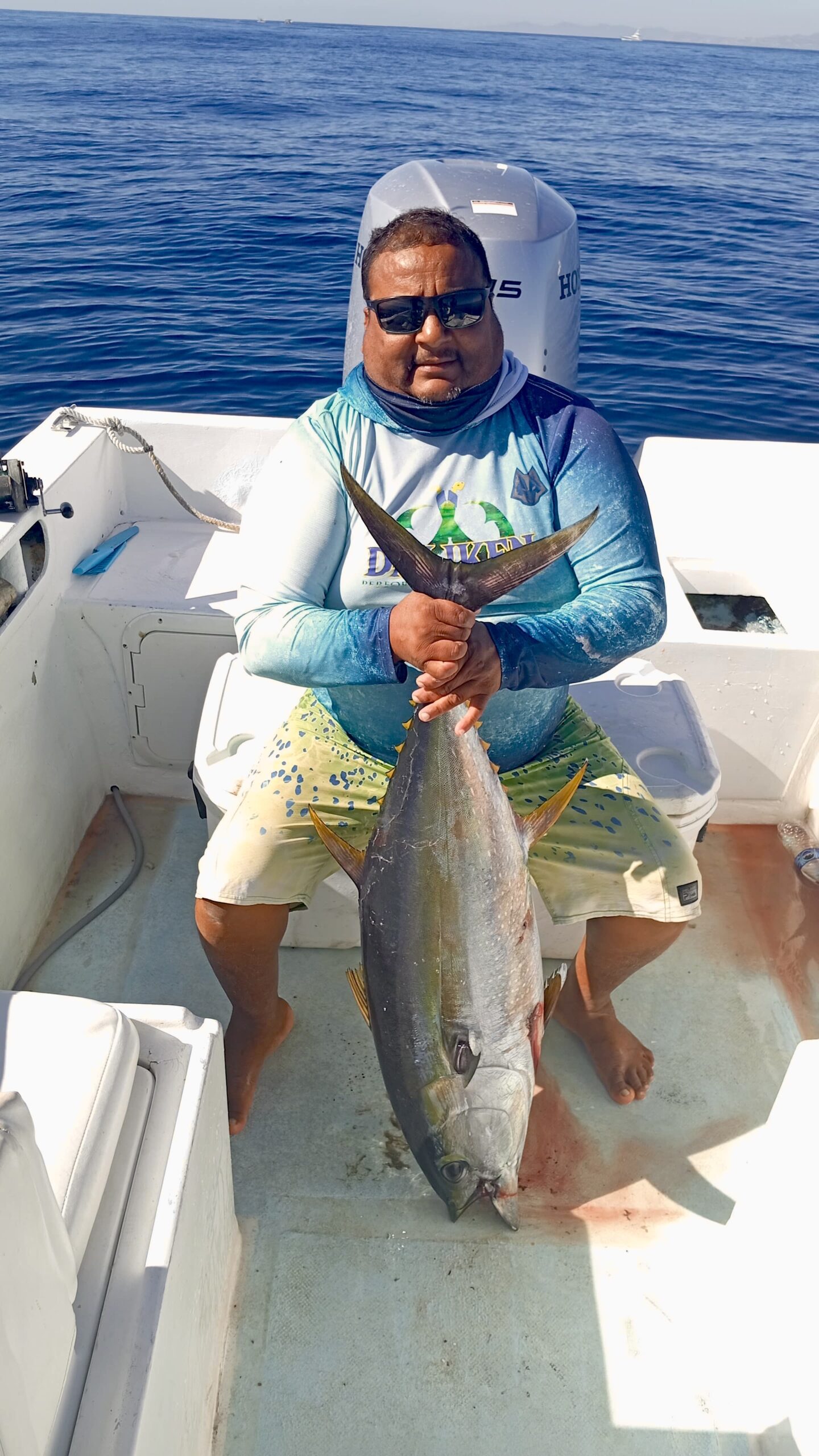 Angler posing with a good-sized yellowfin tuna landed offshore San José del Cabo