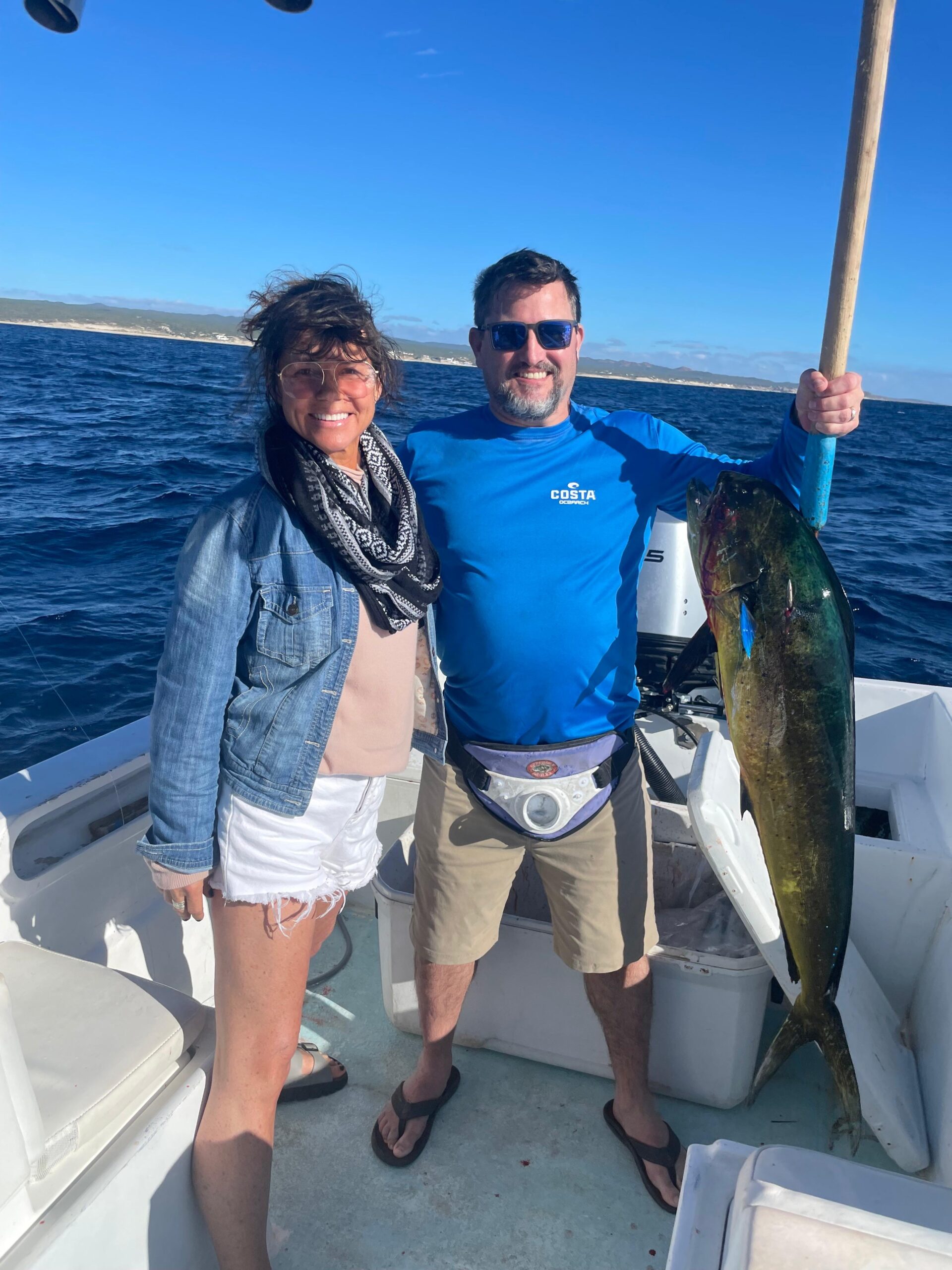 Pair of anglers showing off a solid dorado caught offshore from San José del Cabo