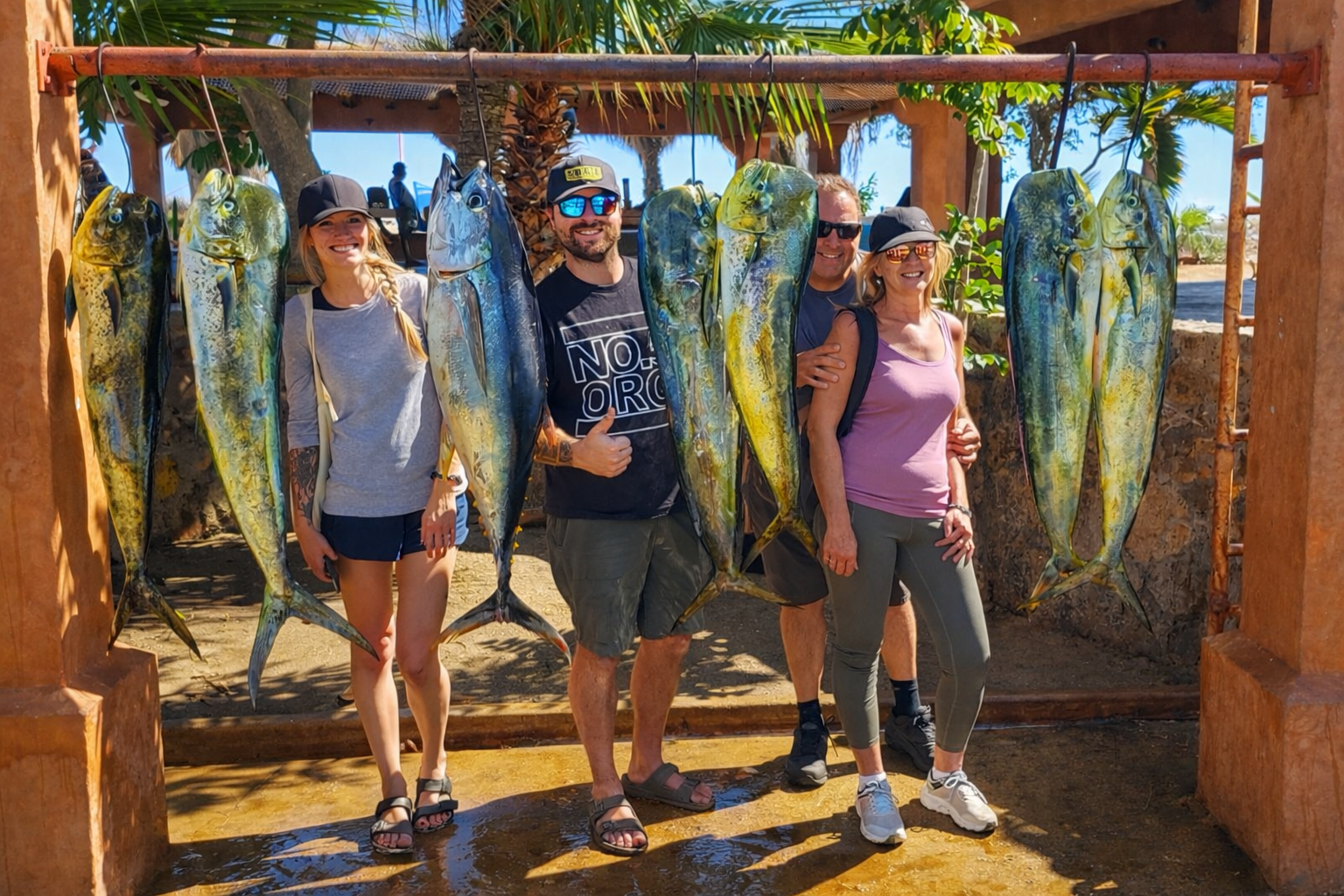 Anglers holding fresh catch on Daliken Sportfishing charter in San José del Cabo