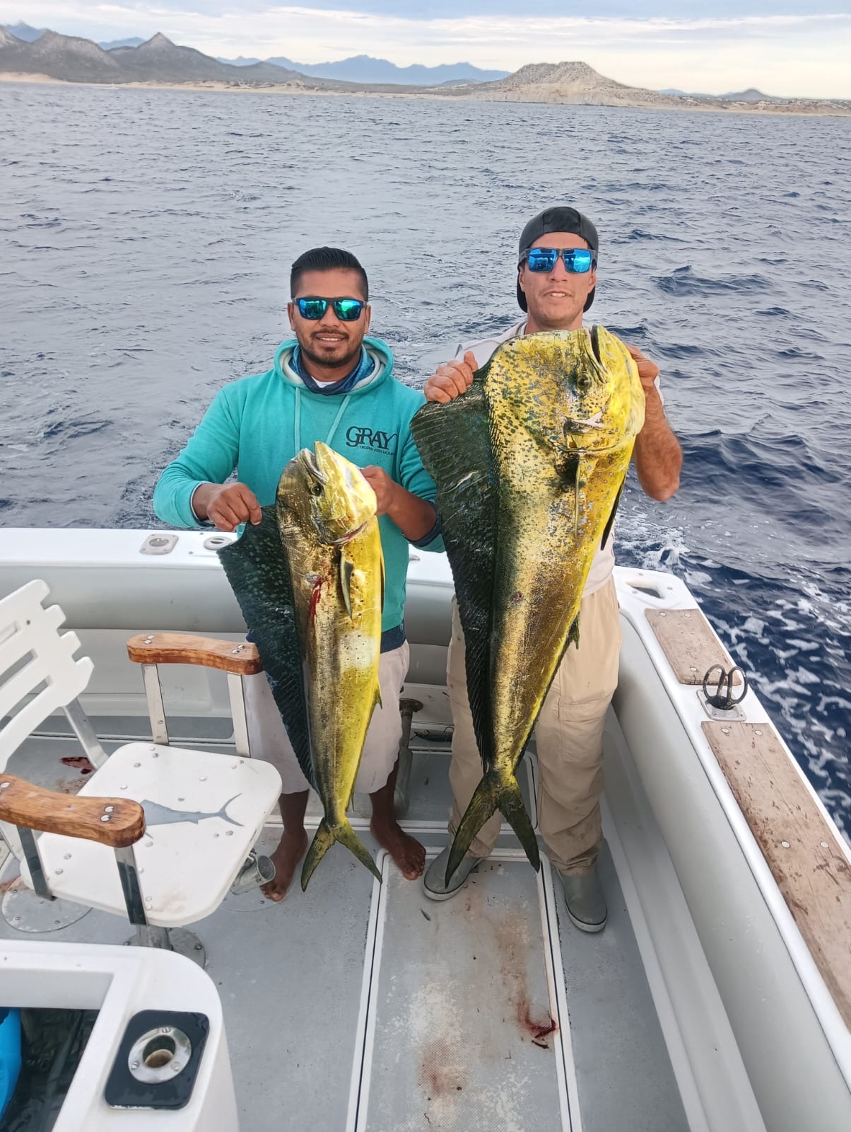 Client photo with a large dorado mahi mahi on a private fishing charter in San José del Cabo
