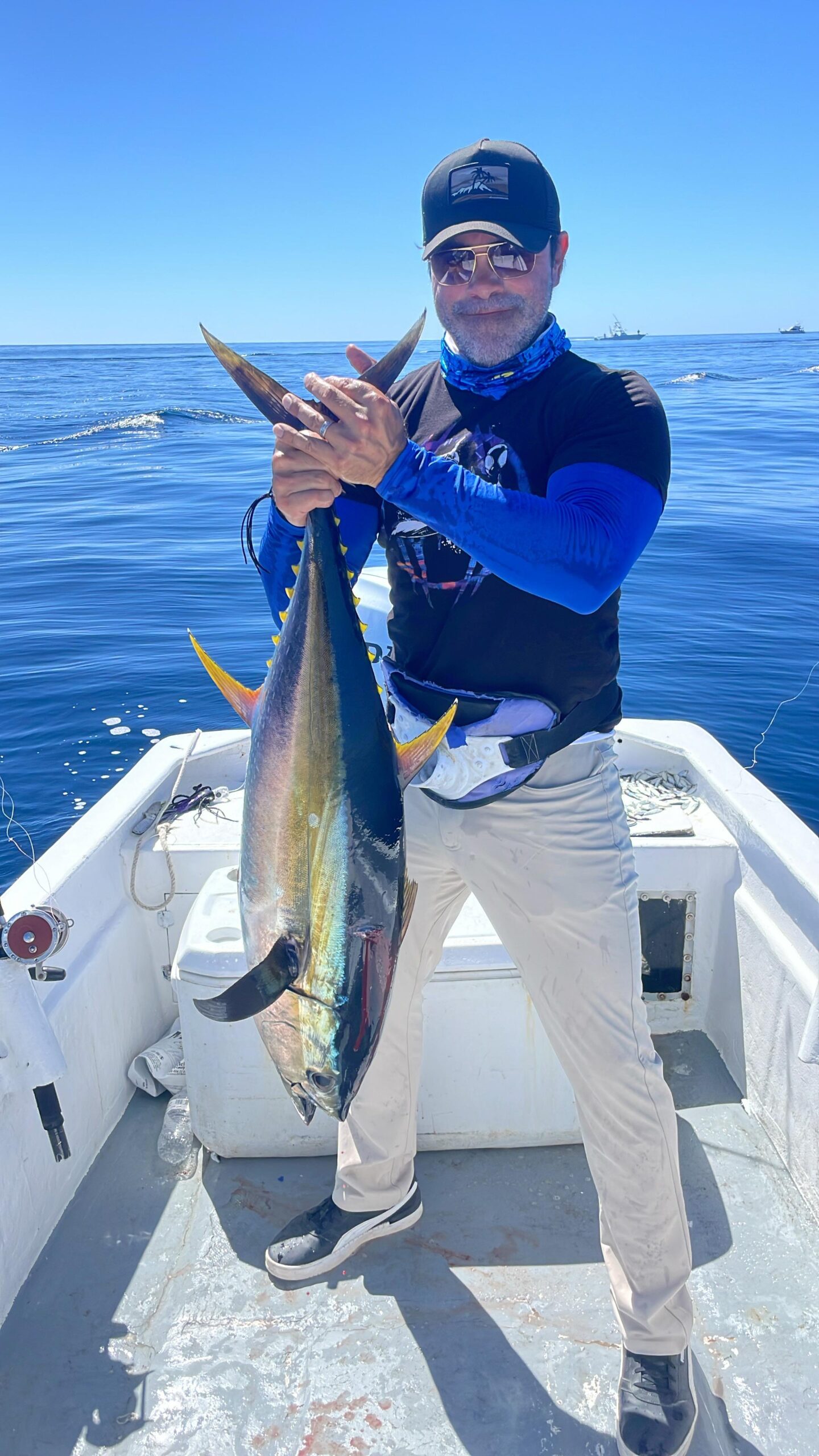 Client holding a yellowfin tuna caught on a Daliken Sportfishing trip in San José del Cabo