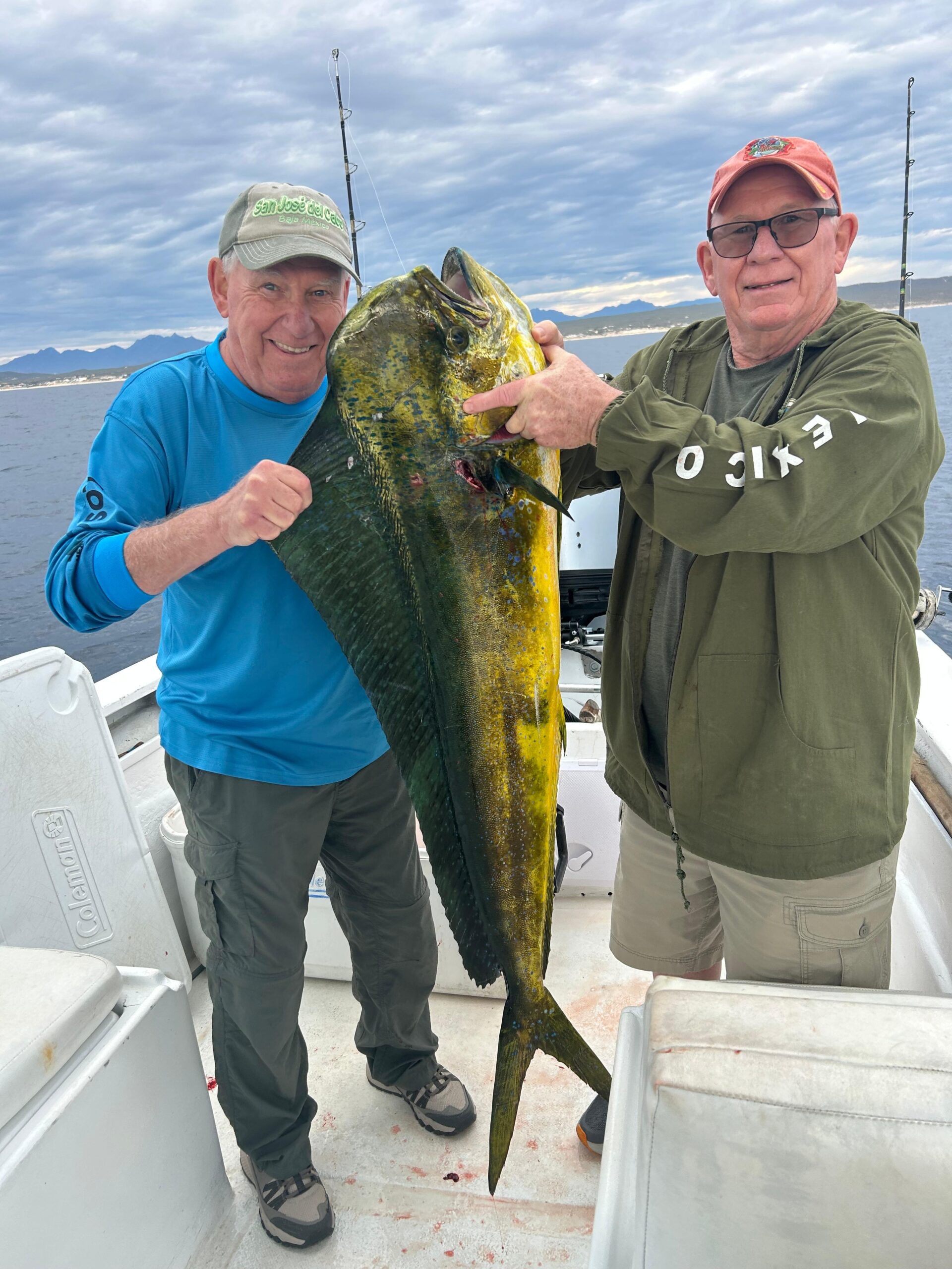 Happy client holding a dorado (mahi mahi) caught with Daliken Sportfishing in San José del Cabo