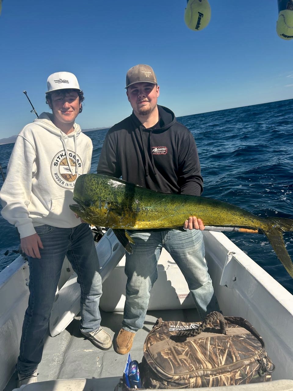 Angler posing with dorado mahi mahi catch aboard Daliken Sportfishing boat in Los Cabos